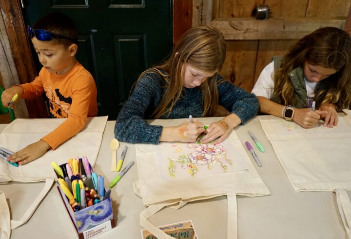 Kids working on art bags