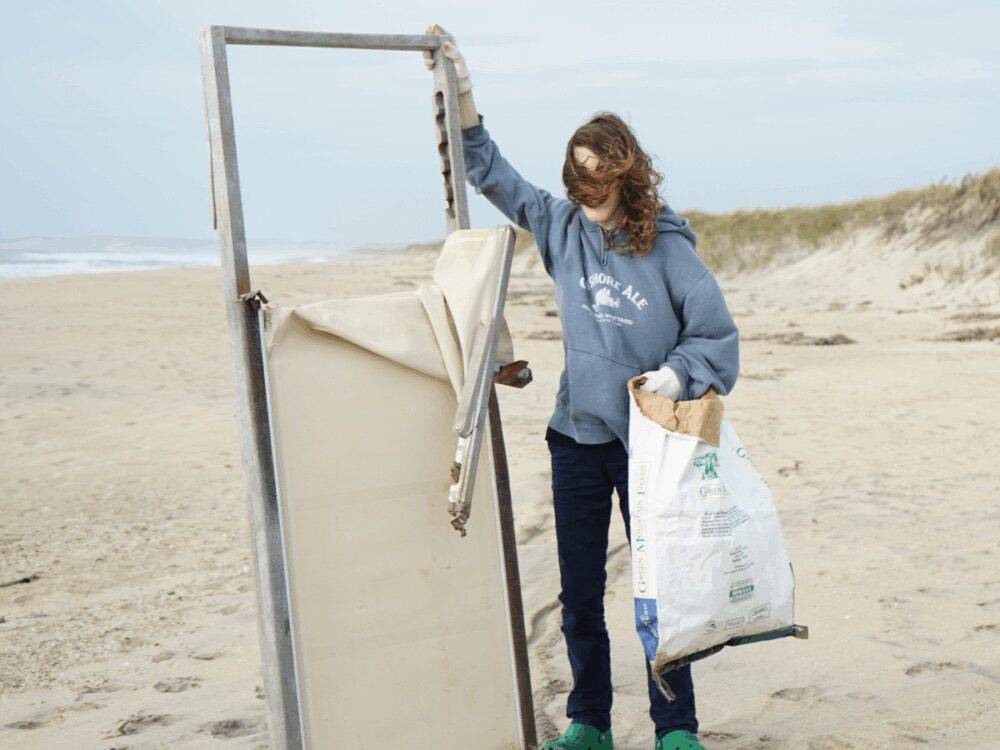 Volunteers posing with litter collected during the Vineyard Conservation Society Earth Day Beach Cleanup on Martha’s Vineyard
