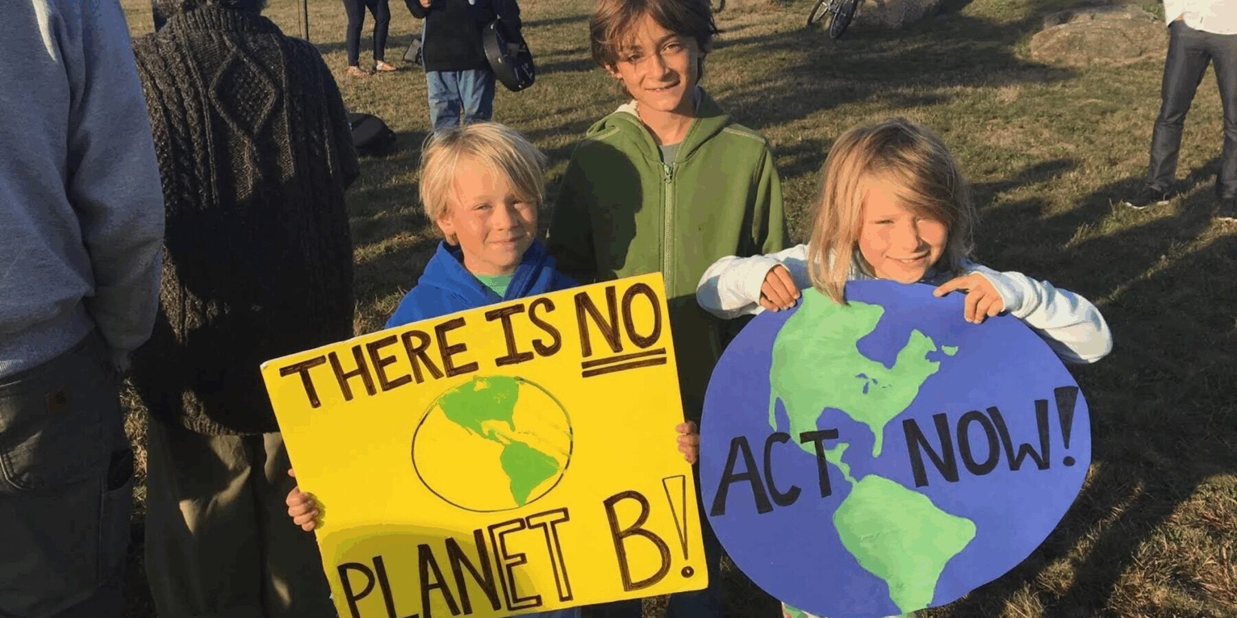 Children holding climate action signs at a community event on Martha’s Vineyard