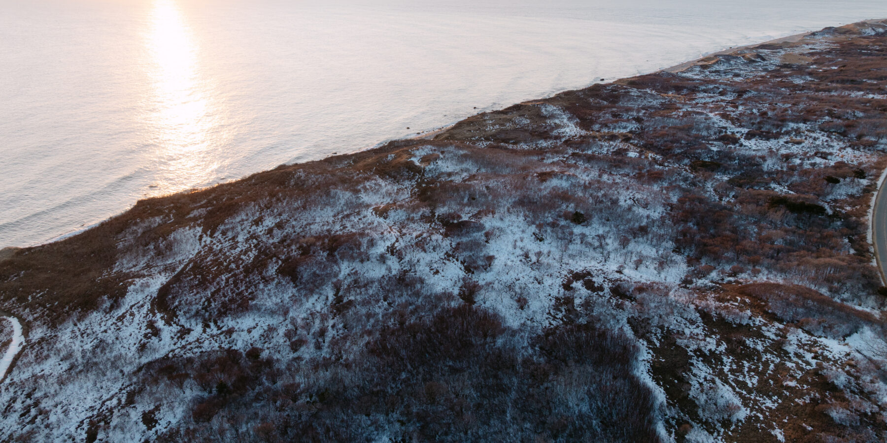 Snowy coastal bluffs and shoreline on Martha’s Vineyard